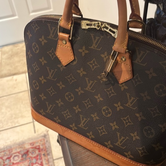 Louis Vuitton Alma Brown Monogram Handbag - Picture 15 of 16